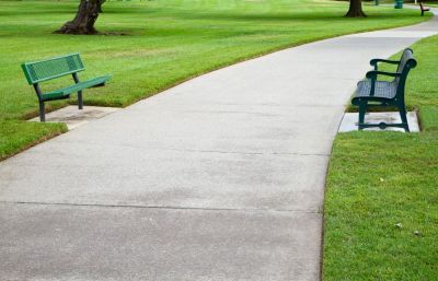 A level sidewalk without any trip hazards in a park