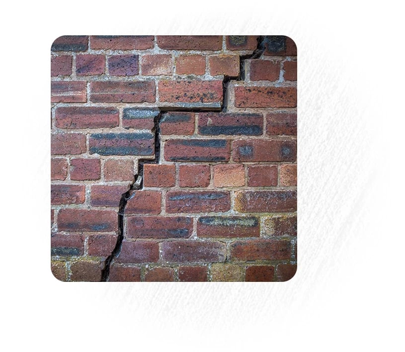 Red brick wall with large crack