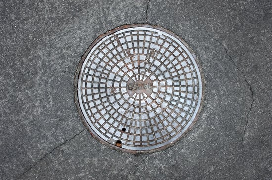 Re-entrant corner crack radiating from manhole cover