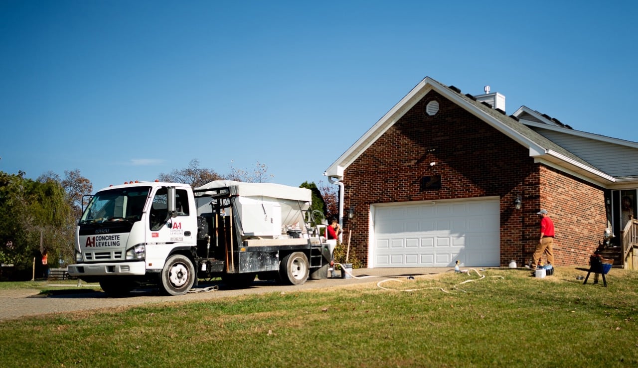 A-1 Concrete Leveling truck parked on the driveway at a residential concrete leveling jobsite