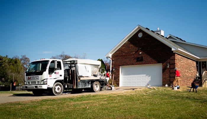 A-1 Concrete Leveling truck parked on the driveway at a residential concrete leveling jobsite