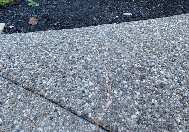 Crack repair in aggregate concrete