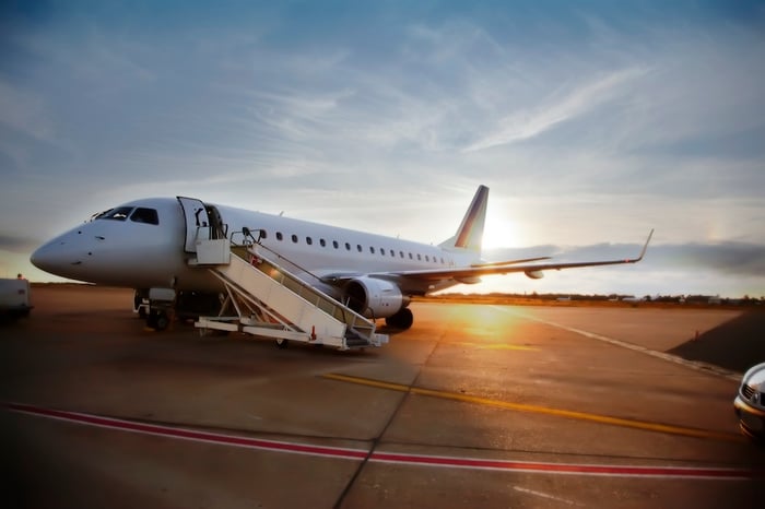 Airplane parked on concrete runway