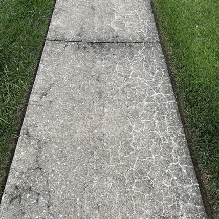 Crumbling concrete sidewalk slab
