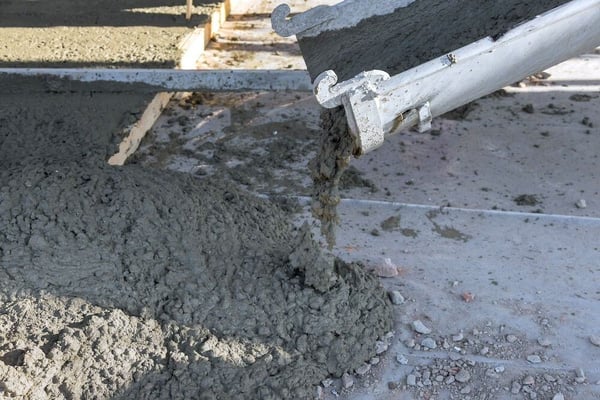 Concrete being poured into form