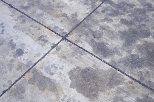 Concrete slabs with many oil stains all over