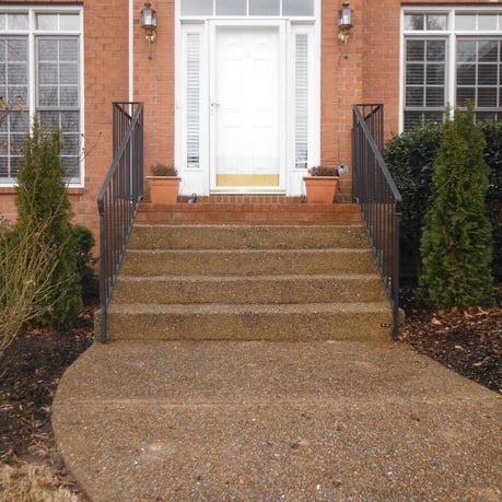 Concrete steps leading to front porch