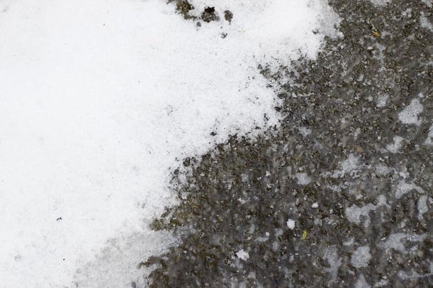 Concrete with snow and ice on top of the slab