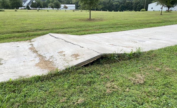 Concrete slab cracked in half due to heaving movement