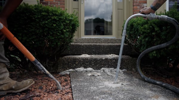Concrete porch step and front walkway during concrete leveling repair
