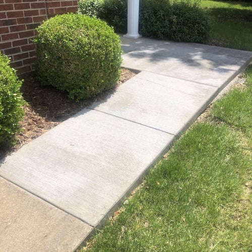 Crack in new concrete sidewalk slab