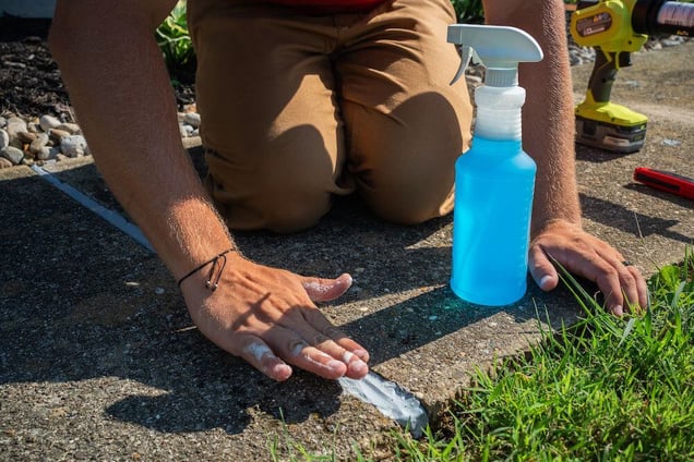 Smoothing out concrete caulk with soapy water