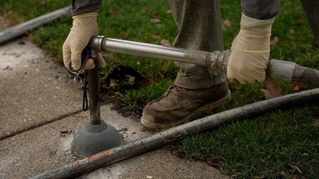 Stone slurry grout concrete leveling nozzle pumping limestone slurry beneath settled concrete