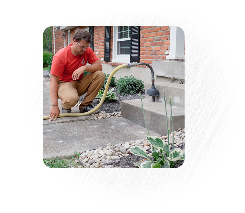 Man concrete leveling sunken front porch steps