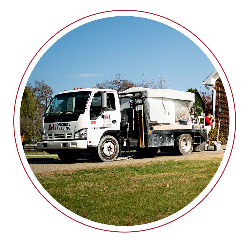 Concrete leveling truck in driveway