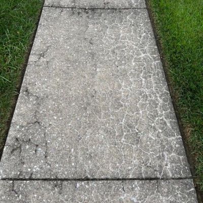 Concrete sidewalk crumbling