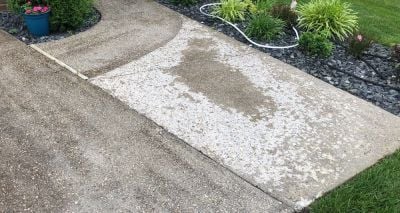 Concrete slab covered in white spalling patches